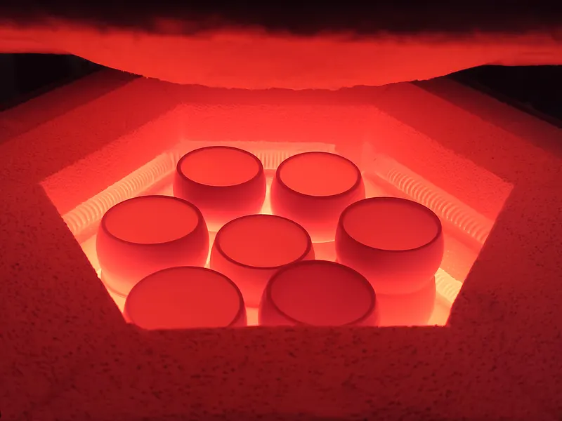 Ceramic components being dried in a high-temperature kiln for building material applications.
