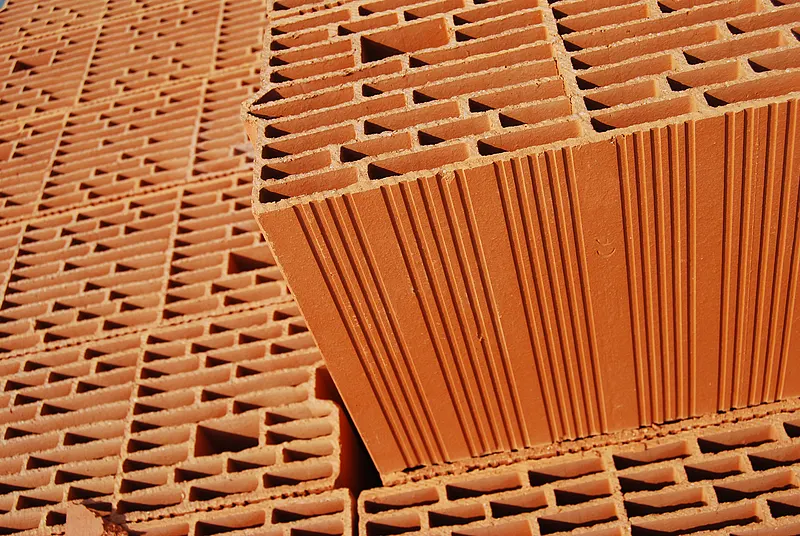 Stack of hollow bricks used in building material drying applications.